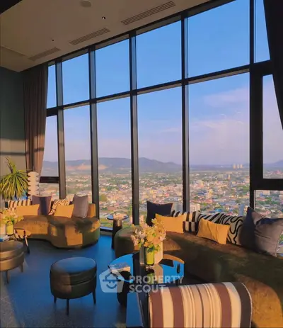 Luxurious high-rise living room with panoramic city views and elegant decor
