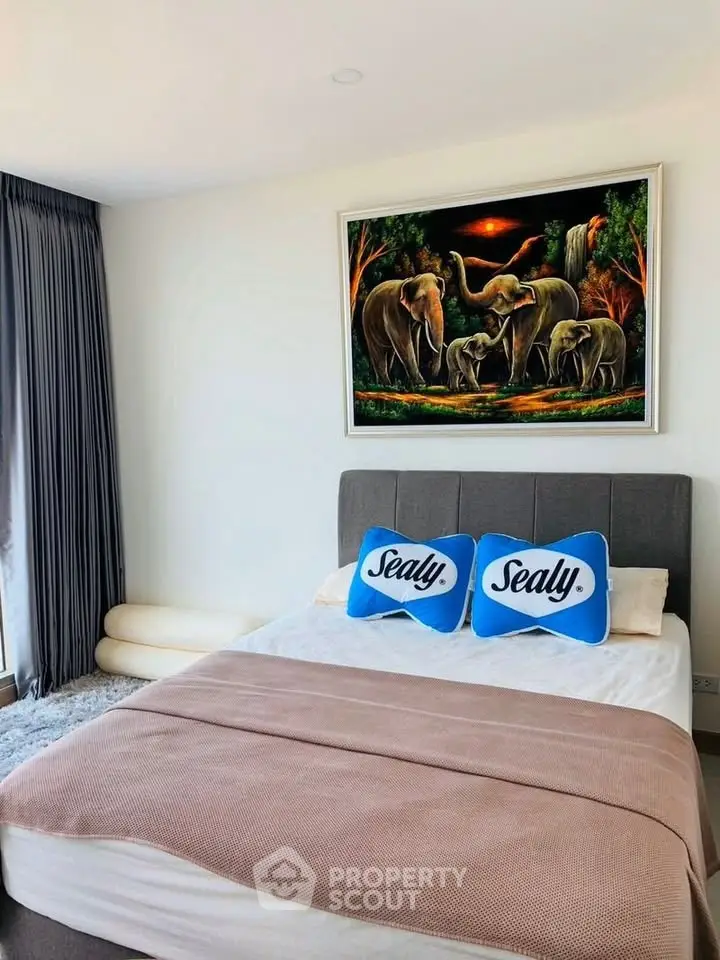 Elegant bedroom with plush bedding and artistic elephant painting, featuring large windows and modern decor.