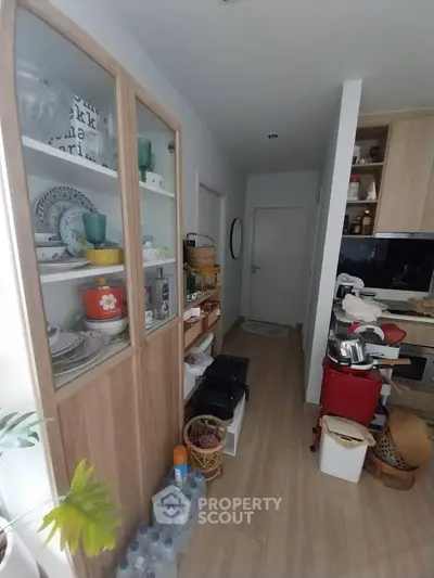 Cozy kitchen with wooden cabinets and modern appliances, perfect for culinary enthusiasts.