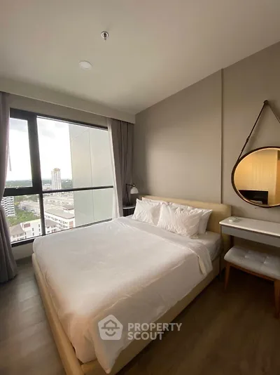 Modern bedroom with city view and stylish decor