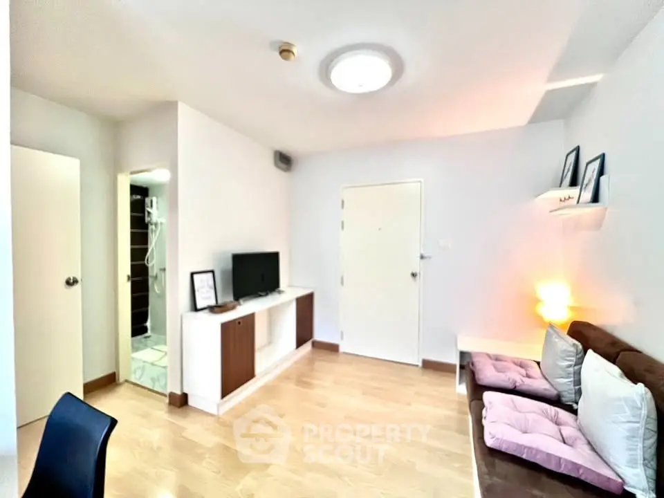 Modern living room with sleek design and cozy seating area