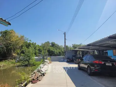 Charming rural property with serene surroundings and ample parking space.