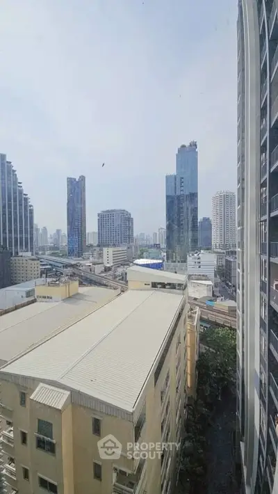 Stunning cityscape view from high-rise building showcasing urban skyline and modern architecture.