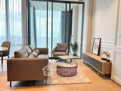 Modern living room with stylish furniture and large windows offering a stunning view.