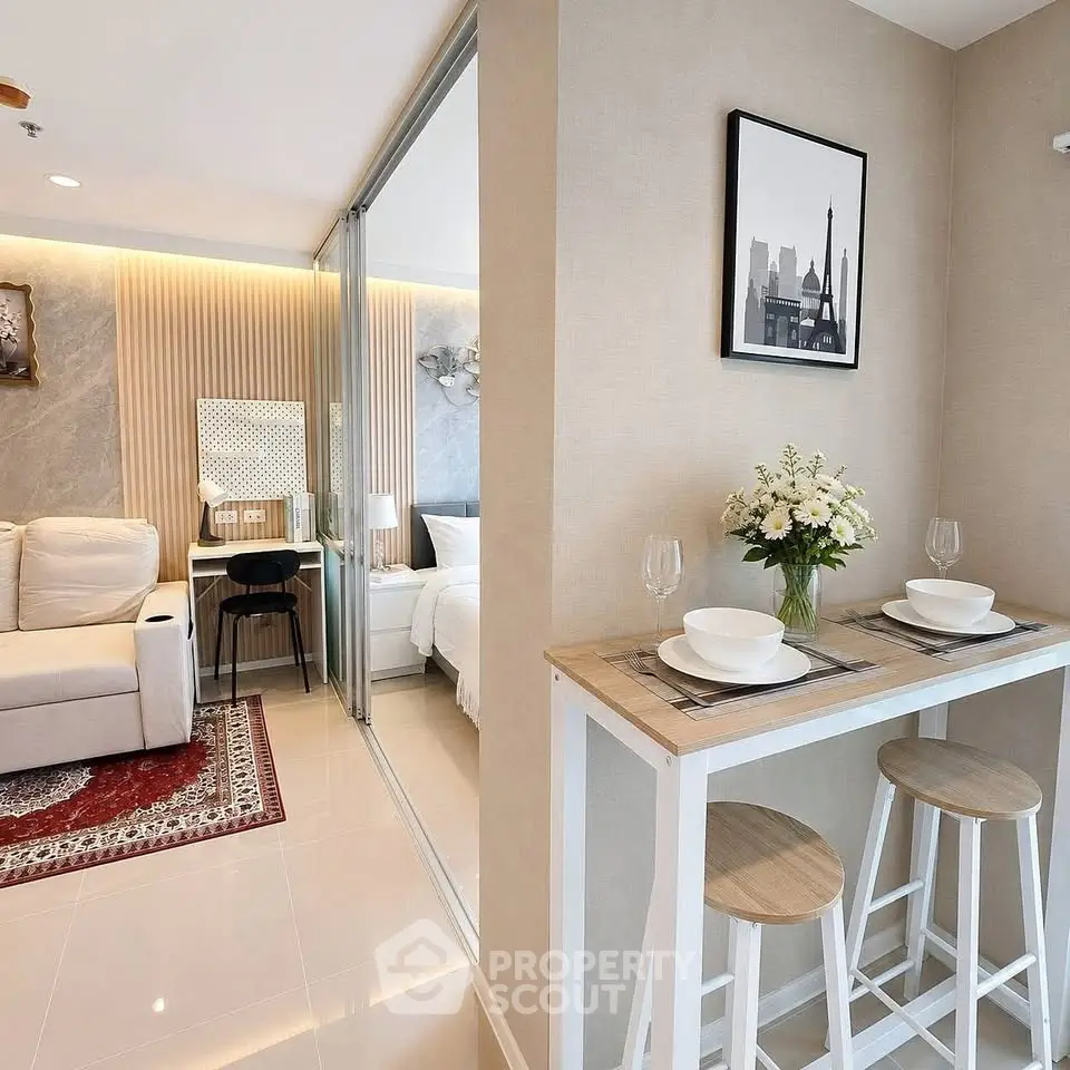 Modern open-plan living room with cozy dining area and stylish decor