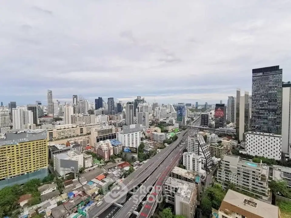 Stunning cityscape view showcasing urban skyline and highway, perfect for real estate investment opportunities.