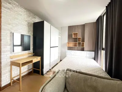 Modern bedroom with stylish decor and ample natural light