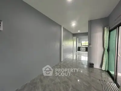 Spacious modern interior with glossy floors and large windows