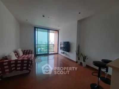 Spacious living room with city view and modern decor in high-rise apartment