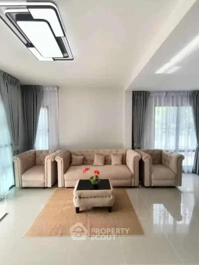 Elegant living room with modern furniture and natural light