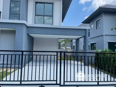 Modern two-story house with sleek design and spacious driveway