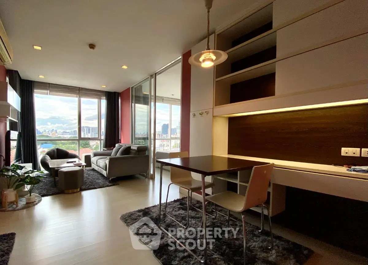Modern living room with city view, stylish furniture, and open layout for luxurious urban living.