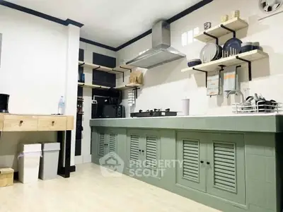 Modern kitchen with sleek cabinetry and open shelving