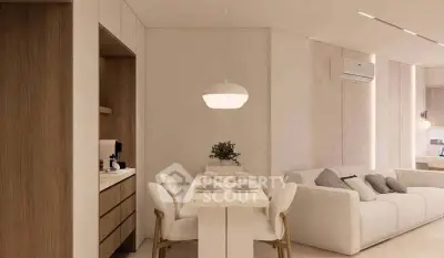 Modern open-plan living room with dining area, featuring sleek furniture and neutral tones.