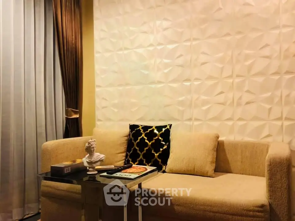 Stylish living room with textured wall and cozy beige sofa