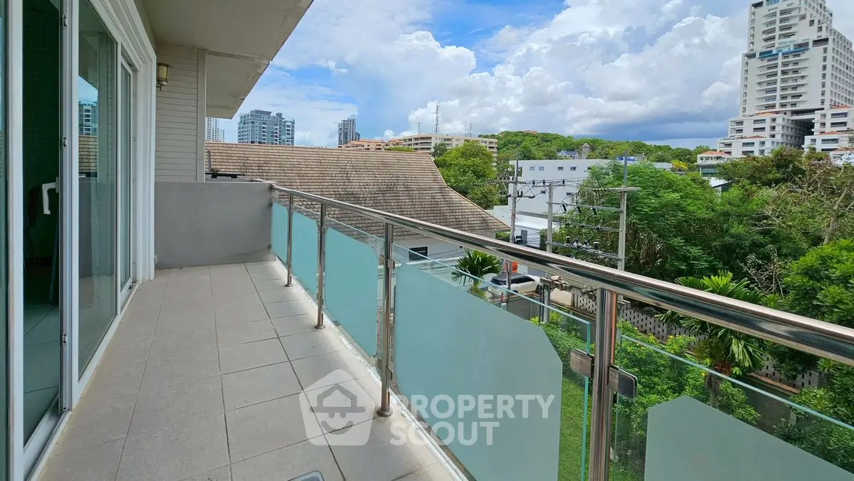 Spacious balcony with city view, perfect for relaxation and enjoying the skyline.