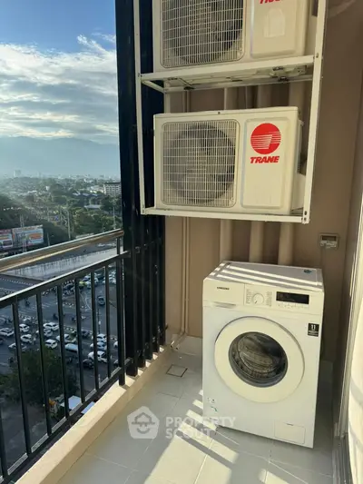 Modern balcony with washing machine and scenic city view, perfect for urban living.