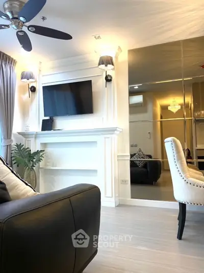 Elegant living room with modern decor and wall-mounted TV
