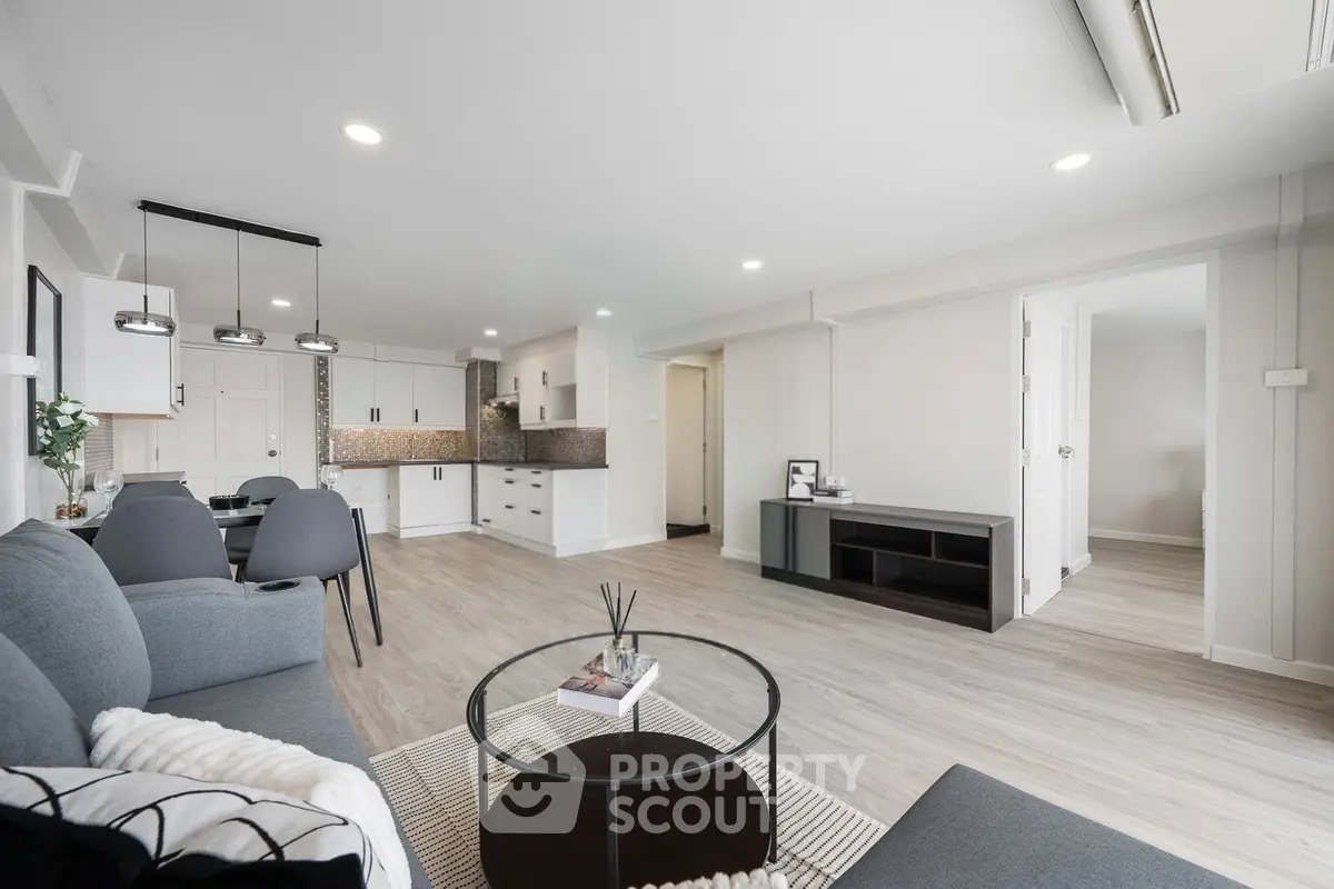 Spacious modern living room with open kitchen and stylish decor