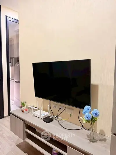 Modern living room with wall-mounted TV and stylish decor