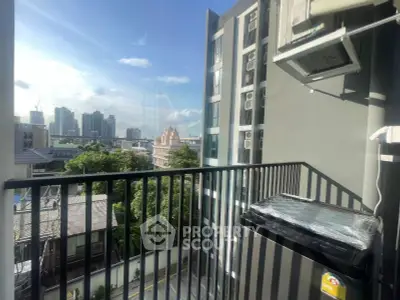 Modern balcony with city view and air conditioning unit in urban apartment