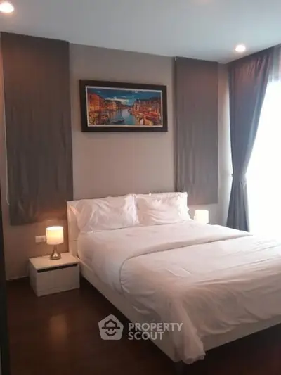 Elegant bedroom with cozy lighting and modern decor, perfect for relaxation.