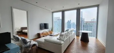 Luxurious high-rise living room with stunning city views and modern furnishings.