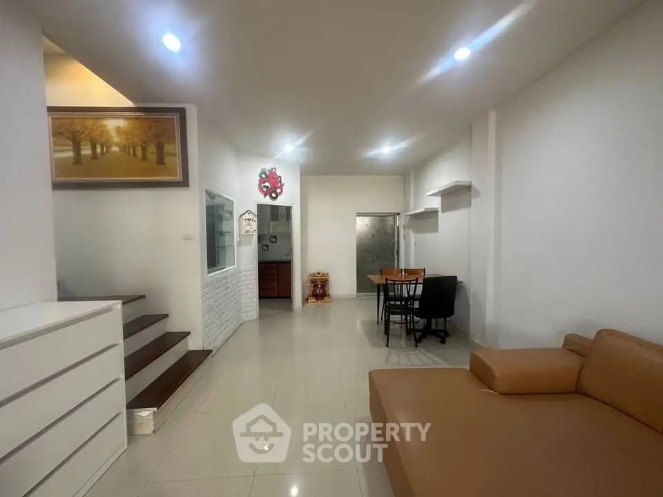 Spacious living room with modern decor and cozy seating area