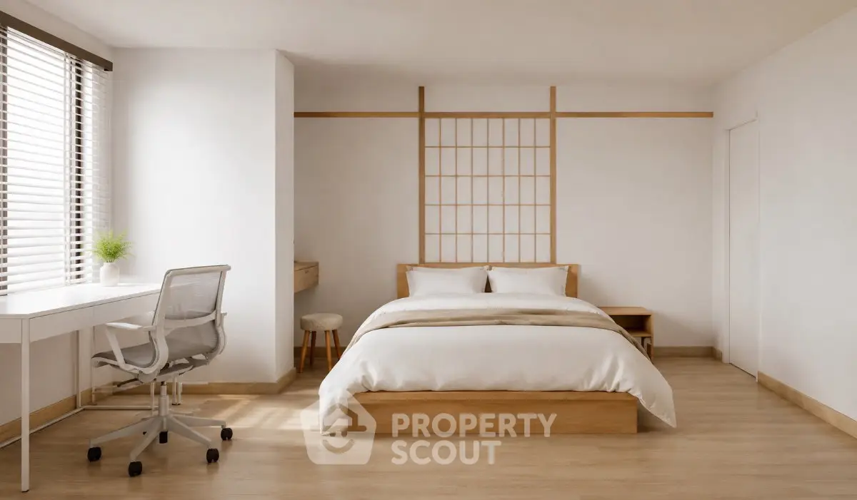 Spacious minimalist bedroom with natural light and modern furnishings