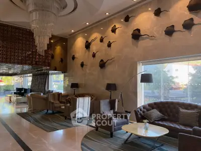Luxurious hotel lobby with elegant seating and artistic wall decor