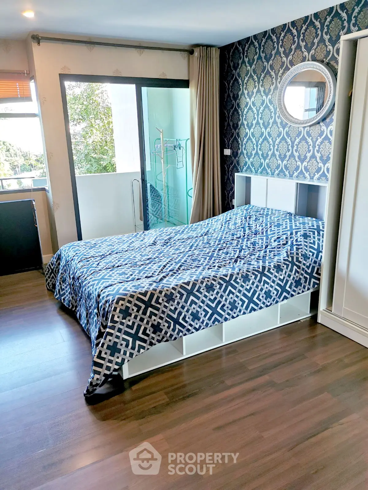 Stylish bedroom with modern decor and balcony access