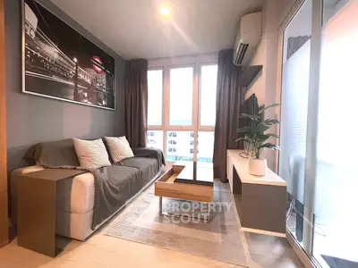 Modern living room with stylish decor and large windows for natural light.