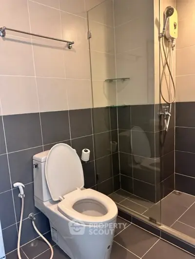 Modern bathroom with glass shower and sleek tile design
