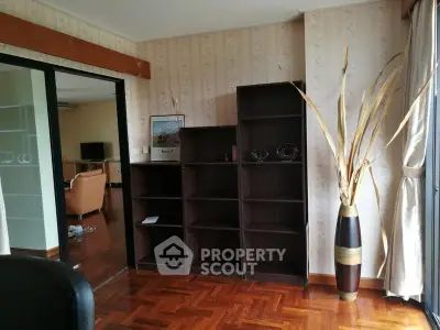 Spacious living room with elegant wooden flooring and modern decor
