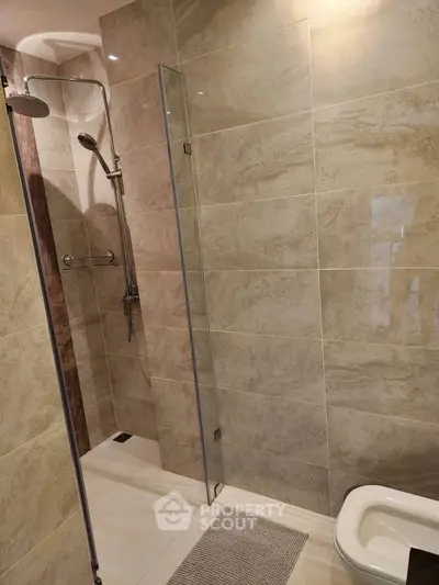 Modern bathroom with sleek shower and elegant tile design