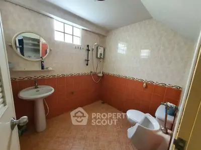 Spacious bathroom with modern fixtures and natural light
