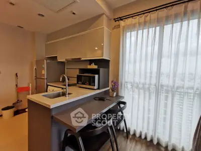 Modern kitchen with sleek design and city view from window