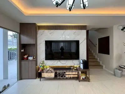 Modern living room with stylish TV setup and elegant lighting