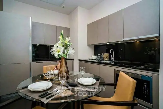 Modern kitchen with sleek cabinetry and elegant dining setup