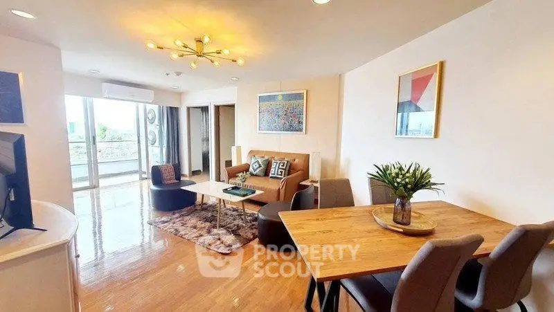 Spacious modern living room with stylish decor and balcony access