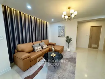 Modern living room with elegant brown sofa and stylish decor