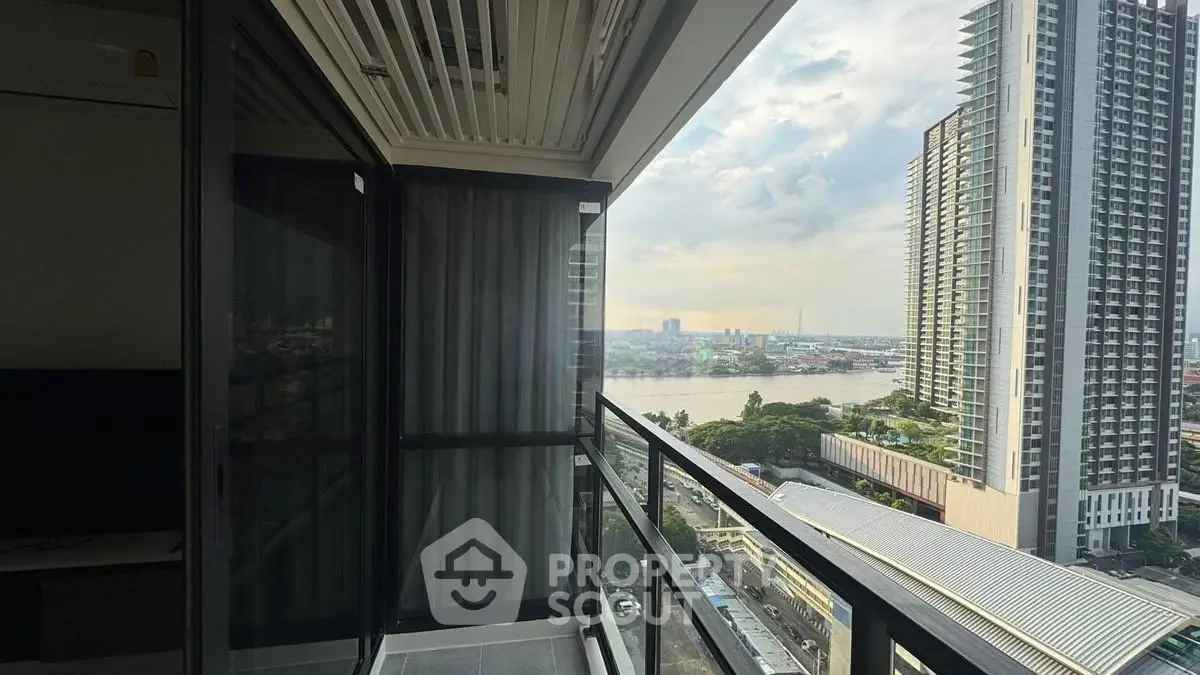 Stunning high-rise balcony view overlooking cityscape and river, perfect for urban living.