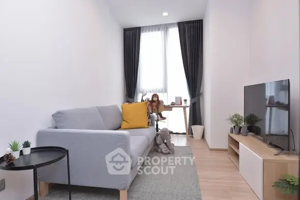 Modern living room with cozy sofa and stylish decor in a bright apartment.