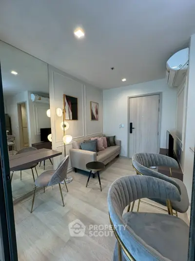 Stylish modern living room with elegant furniture and chic decor in a contemporary apartment.