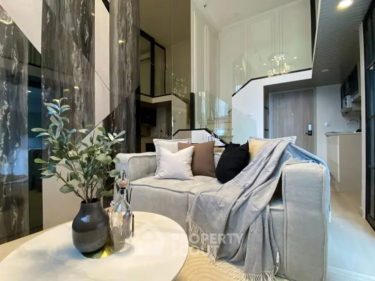 Luxurious modern living room with elegant decor and high ceilings