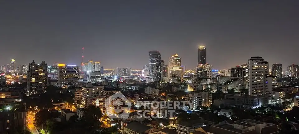 Stunning city skyline view at night with illuminated skyscrapers and vibrant urban landscape.