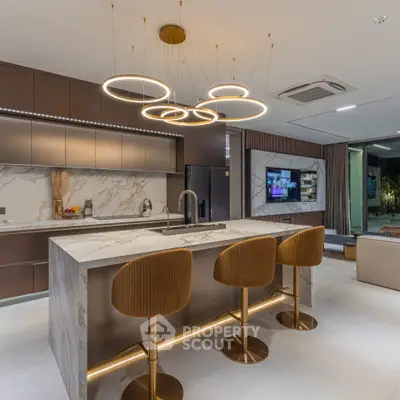 Luxurious modern kitchen with marble island and stylish lighting