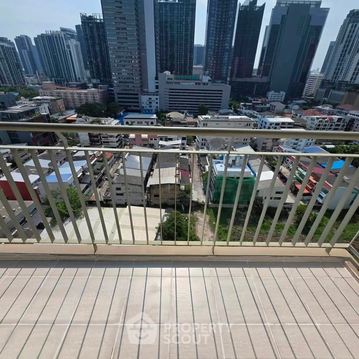 Stunning cityscape view from a high-rise balcony, perfect for urban living enthusiasts.