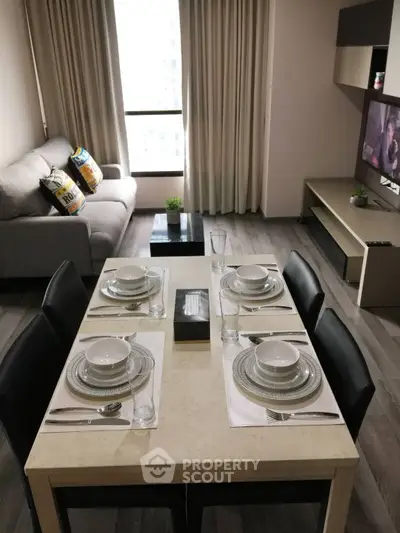Modern living room with dining area, stylish decor, and natural light, perfect for urban living.