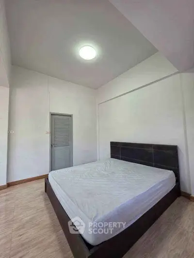 Spacious bedroom with minimalist design and natural light
